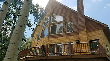 Sandblasting on Mountain Cabin by Abrasive Solutions